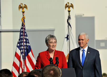 U.S. Vice President Mike Pence listens as Air Force Secretary Heather Wilson addresses USAF personnel after the launch of SpaceX Falcon 9 rocket, scheduled to launch a U.S. Air Force navigation satellite, was postponed after an abort procedure was triggered by the onboard flight computer, at Cape Canaveral, Florida, U.S., December 18, 2018. REUTERS/Steve Nesius