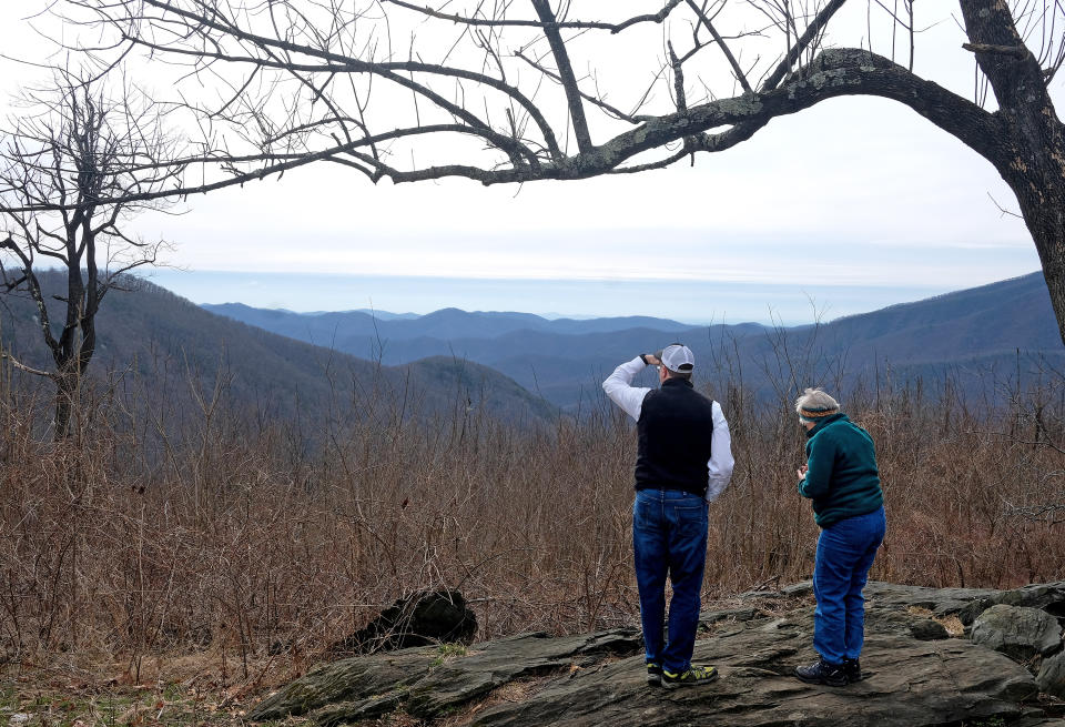 Gregory Buppert, a Southern Environmental Law Center attorney, and Lynn Cameron, a Virginia Wilderness Committee board member, survey a spot along the Appalachian Trail in February 2020 near Wintergreen. In the valley below them is where the Atlantic Coast Pipeline would emerge. (Photo: Norm Shafer for The Washington Post via Getty Images)