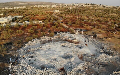 An aerial shot taken of the site that was hit by helicopter gunfire during a raid on Baghdadi's location near the northwestern Syrian village of Barisha in the Idlib province - Credit: AFP