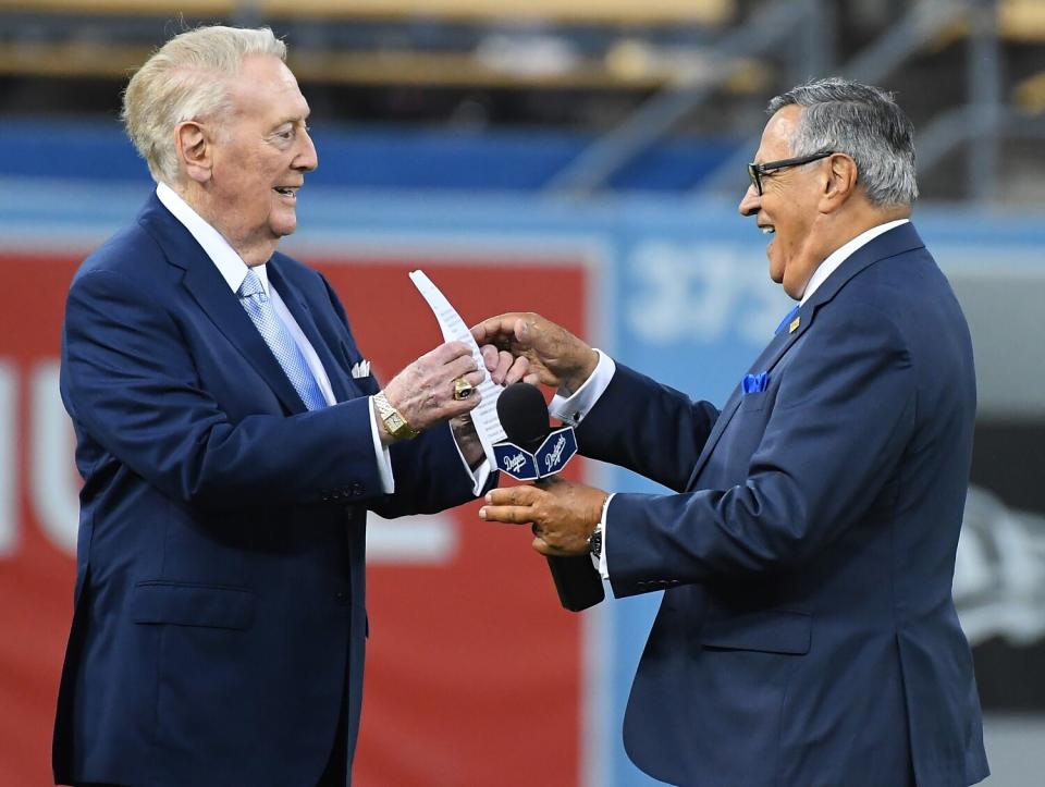 Vin Scully smiles with Jaime Jarrín