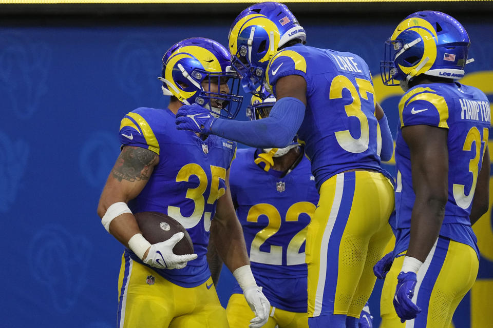 Los Angeles Rams linebacker Jacob Hummel, left, celebrates his interception for a touchdown with teammates during the first half of a preseason NFL football game against the Las Vegas Raiders Saturday, Aug. 19, 2023, in Inglewood, Calif. (AP Photo/Mark J. Terrill)