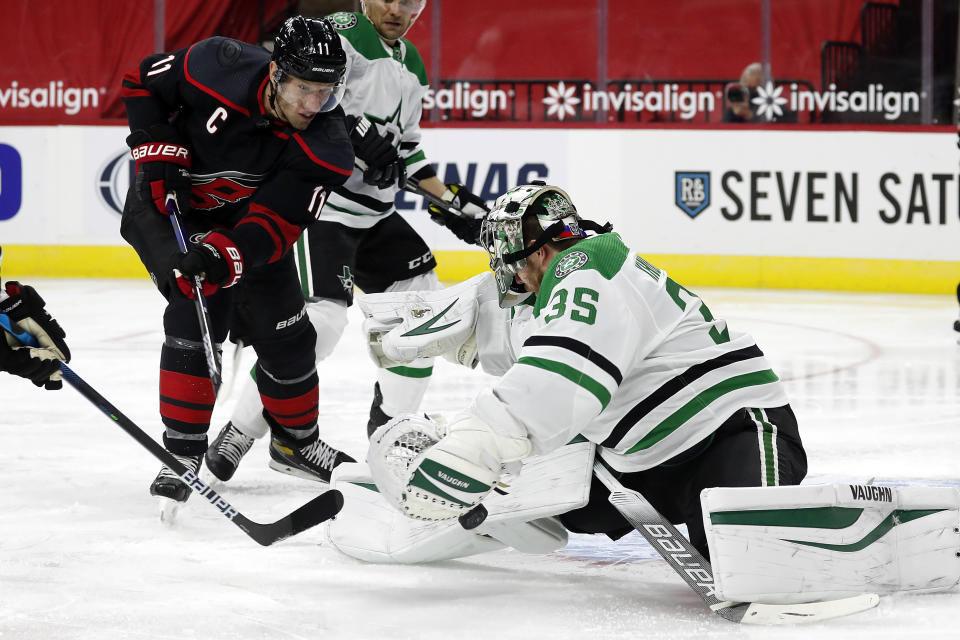 Carolina Hurricanes' Jordan Staal (11) has his shot blocked by Dallas Stars goaltender Anton Khudobin (35) during the second period of an NHL hockey game in Raleigh, N.C., Saturday, Jan. 30, 2021. (AP Photo/Karl B DeBlaker)