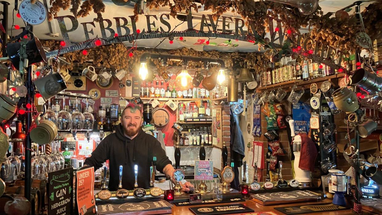 Dean Manly behind the bar at Pebbles Tavern