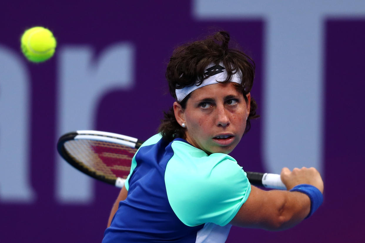 DOHA, QATAR - FEBRUARY 25:  Carla Suarez Navarro of Spain returns a backhand against Petra Kvitova of Czech Republic during Day 3 of the WTA Qatar Total Open 2020 at Khalifa International Tennis and Squash Complex on February 25, 2020 in Doha, Qatar. (Photo by Dean Mouhtaropoulos/Getty Images)