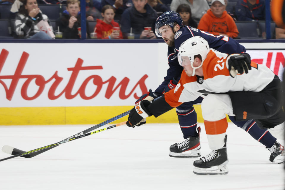 Columbus Blue Jackets' Emil Bemstrom, rear, and Philadelphia Flyers' Nick Seeler chase the puck during the second period of an NHL hockey game Thursday, Oct. 12, 2023, in Columbus, Ohio. (AP Photo/Jay LaPrete)