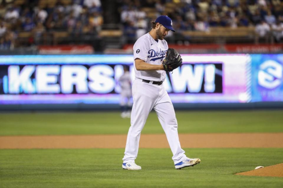 Clayton Kershaw walks back to the mound after striking out a batter against the Arizona Diamondbacks.