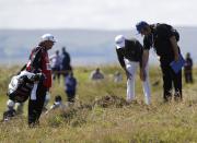 Golf-British Open - Justin Thomas of the U.S. looks for his ball on the 15th hole during the first round - Royal Troon, Scotland, Britain - 14/07/2016. REUTERS/Craig Brough