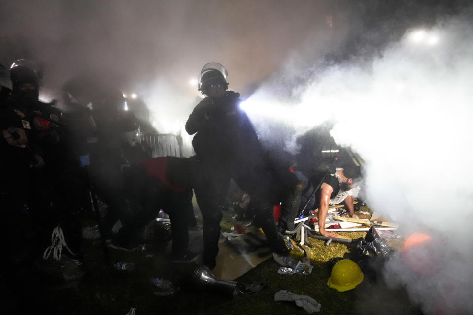 Police enter an encampment set up by pro-Palestinian demonstrators on the University of California, Los Angeles campus Thursday, May 2, 2024, in Los Angeles. (AP Photo/Jae C. Hong)