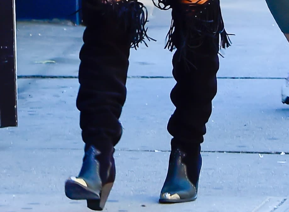 A closer look at the leather boots and legwarmers worn by Irina Shayk in Soho on Wednesday