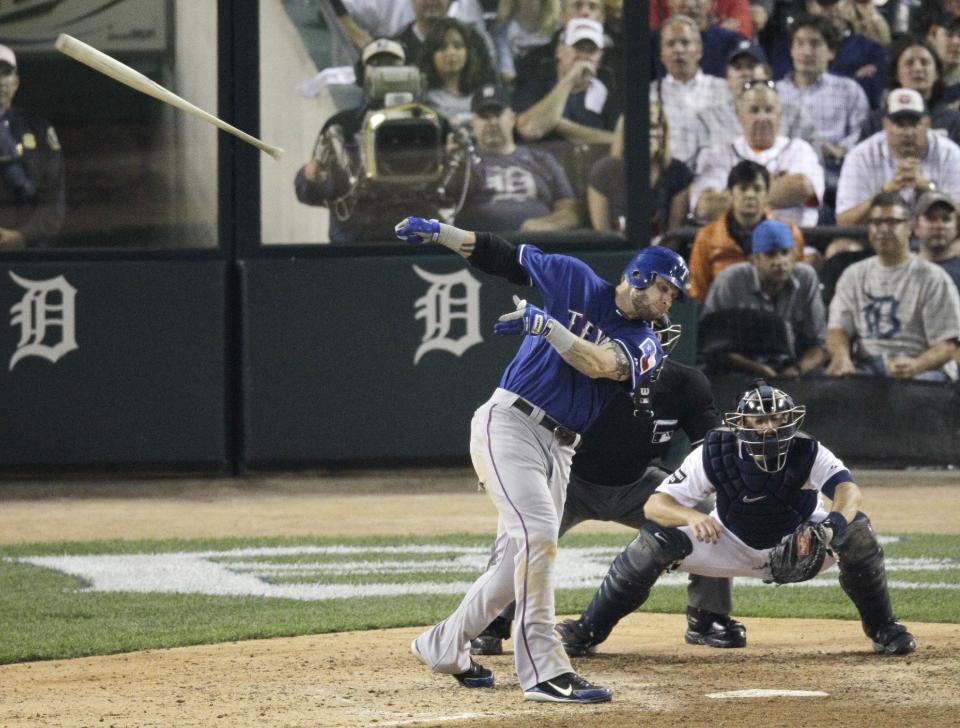 Texas Rangers' Josh Hamilton looses control and swings his bat into the stands during the sixth inning of Game 3 of baseball's American League championship series against the Detroit Tigers, Tuesday, Oct. 11, 2011, in Detroit. (AP Photo/Mark Duncan)