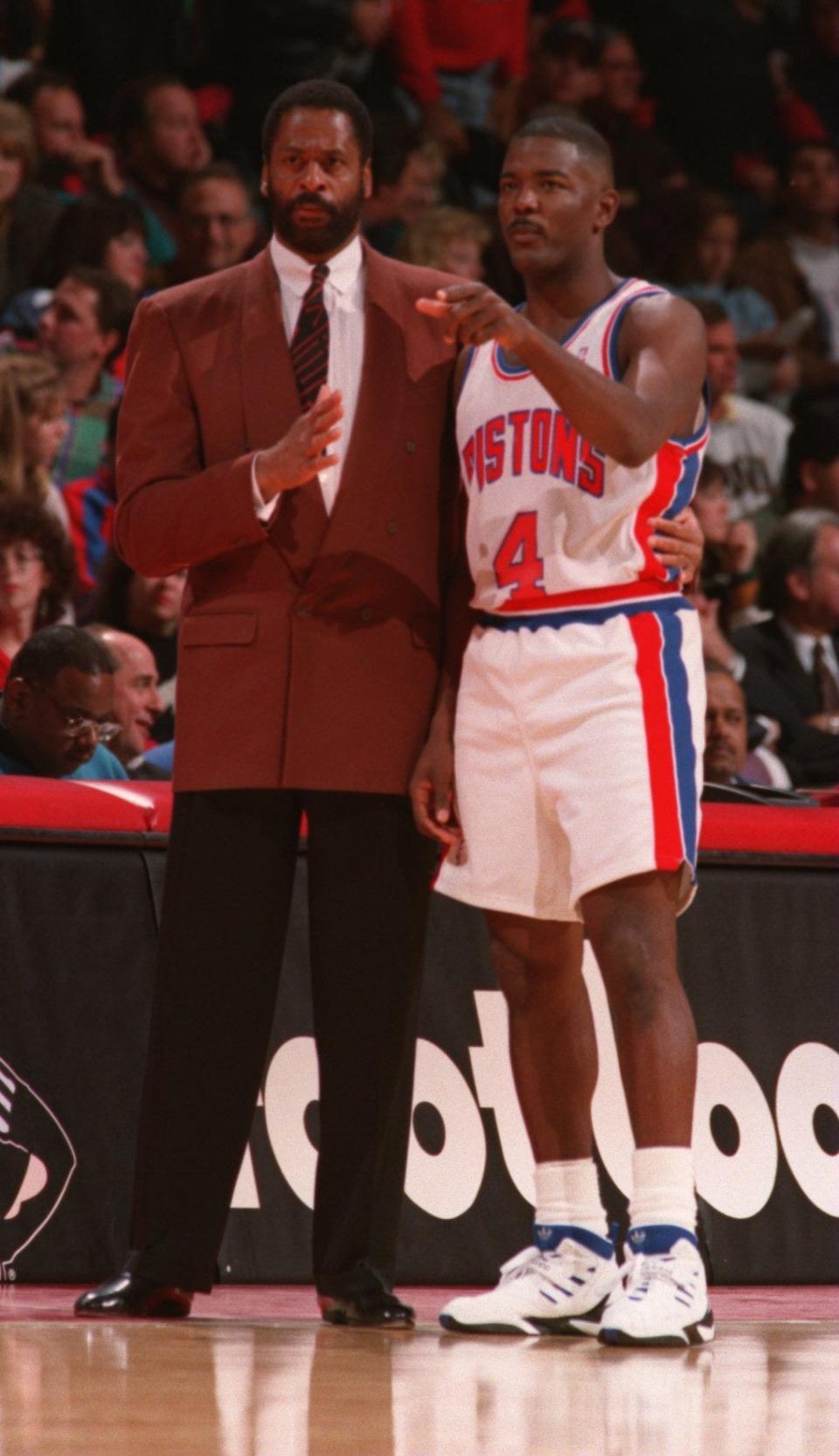 Pistons coach Don Chaney talks over strategy with captain Joe Dumars during a break in the action against the Bucs on Nov. 23, 1994, at the Palace.