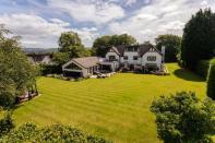 <p>Situated in the heart of the Cheshire countryside, this remarkable home has a stunning pool and leisure facilities, plus a games room, impressive garden and stunning kitchen. Just look at the garden! </p><p><a href="https://www.rightmove.co.uk/property-for-sale/property-58148001.html" rel="nofollow noopener" target="_blank" data-ylk="slk:This property is on the market for £3,950,000 via Gascoigne Halman at Rightmove;elm:context_link;itc:0;sec:content-canvas" class="link ">This property is on the market for £3,950,000 via Gascoigne Halman at Rightmove</a>. </p>