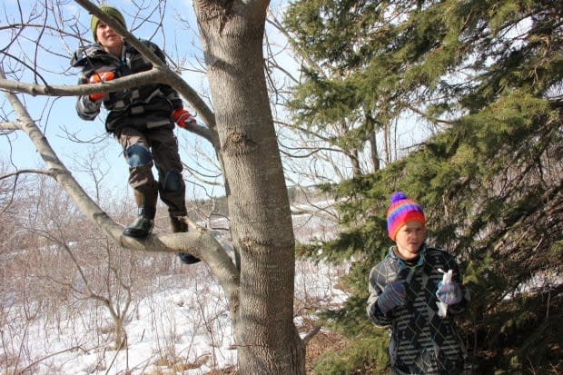 Nyima, right, and his brother Mila were playing in their backyard when the bottle was found. 