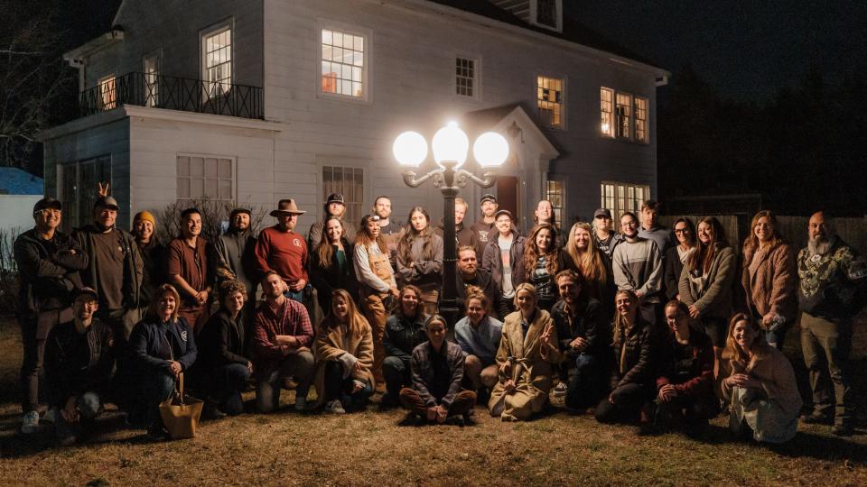 The cast, crew and visitors pose for one final picture together before filming wraps up in the next few days.