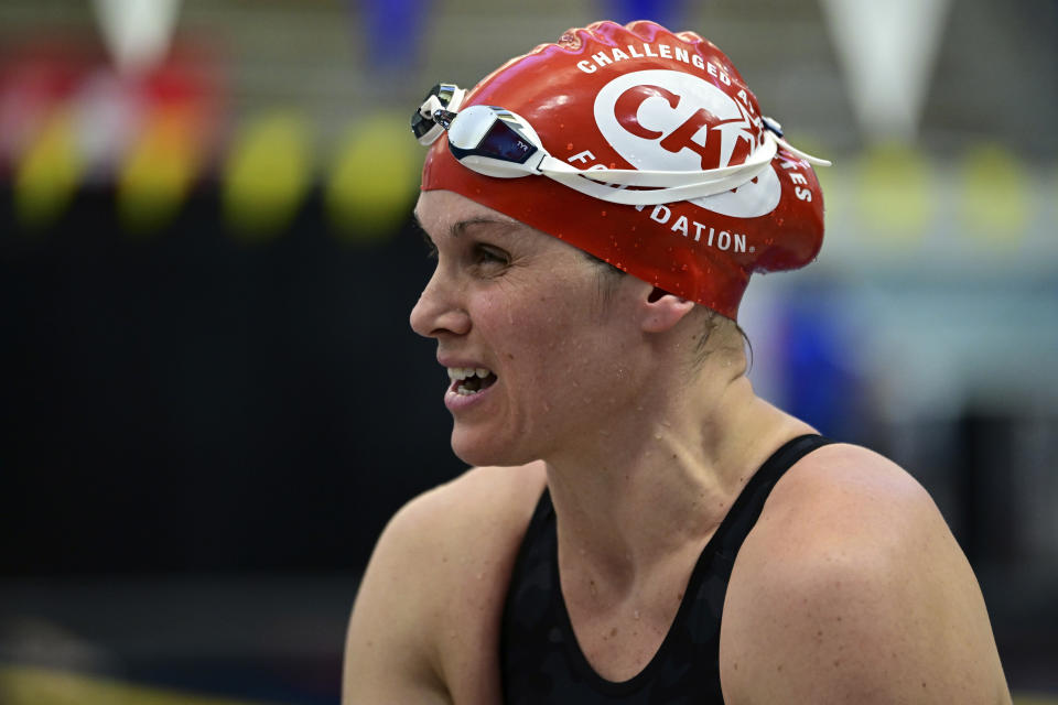 Christie Raleigh Crossley talks with her coach at the 2024 U.S. Paralympic Swim Team Trials in Minneapolis, Friday, June 28, 2024. (AP Photo/Leighton Smithwick)