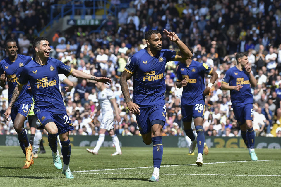 Newcastle's Callum Wilson, center, celebrates with teammates after scoring his side's 2nd goal from the penalty spot during the English Premier League soccer match between Leeds United and Newcastle United at Elland Road in Leeds, England, Saturday, May 13, 2023. (AP Photo/Rui Vieira)