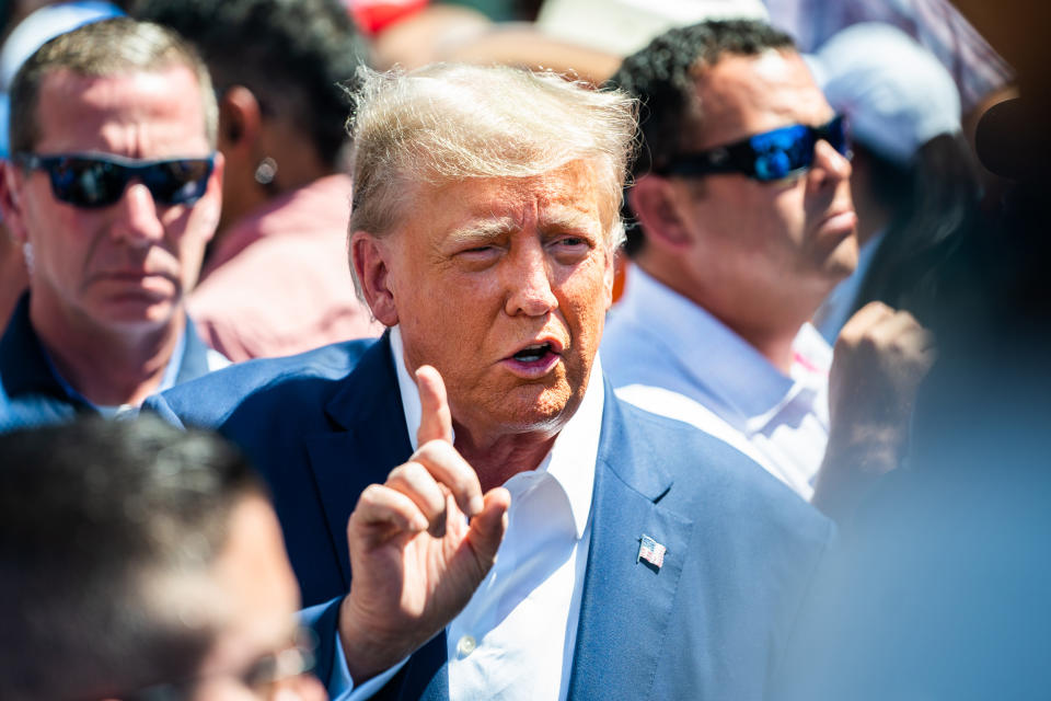 Former President Donald Trump speaks with the press at the Iowa Pork Producers booth during the 2023 Iowa State Fair at the Iowa State Fair Grounds on Aug. 12, 2023.  (Demetrius Freeman / The Washington Post via Getty Images file)