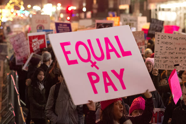 View of a demonstrator as she holds a sign on Fifth Avenue during the Women’s March on New York City on Jan. 21, 2017. Her sign reads “Equal Pay.” (Photo: Chuck Fishman/Getty Images)