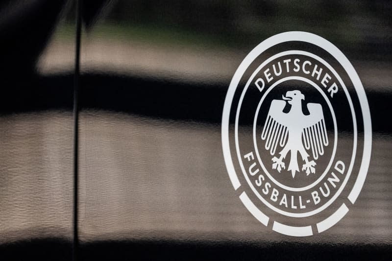 The logo of the German Football Association (DFB) pictured on a vehicle. In cooperation with the DFB, Germany's Central Office for Combating Cybercrime (ZIT) has so far initiated 45 investigations into hate speech online. Swen Pförtner/dpa
