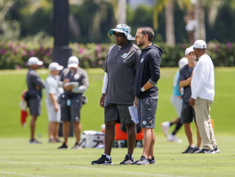 Miami Dolphins General manager Chris Grier and Dolphins head coach Mike McDaniel look from the sidelines during NFL football training camp at Baptist Health Training Complex in Hard Rock Stadium on Wednesday, Sept. 7, 2022 in Miami Gardens, Fla. (David Santiago/Miami Herald via AP)
