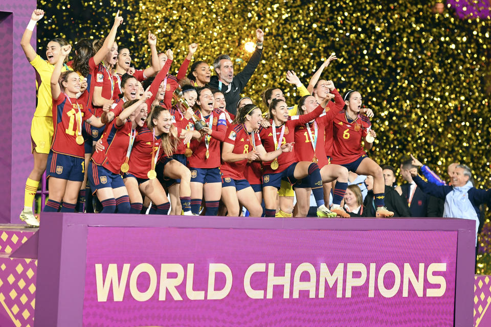 Team Spain celebrates after winning the Women's World Cup soccer final against England at Stadium Australia in Sydney, Australia, Sunday, Aug. 20, 2023. (AP Photo/Steve Markham)