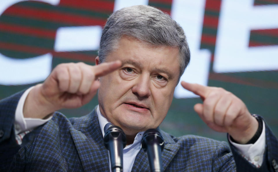 Ukrainian President Petro Poroshenko gestures while speaking at his headquarters after the presidential election in Kiev, Ukraine, Sunday, March 31, 2019. The exit poll released Sunday after voting stations closed indicated that Zelenskiy received about 30.4 percent of the nationwide vote, followed by incumbent President Petro Poroshenko with 17.8 percent and former Prime Minister Yulia Tymoshenko with 14.2 percent support. (AP Photo/Efrem Lukatsky)