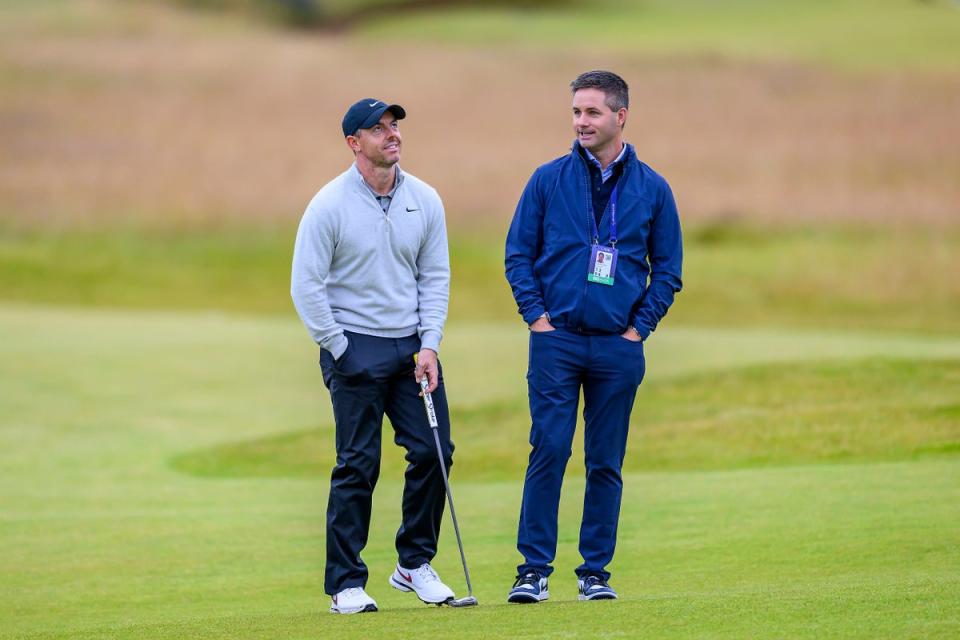 Rory McIlroy speaks with his manager, Sean O’Flaherty, during the Genesis Scottish Open Pro-Am (PA Wire)