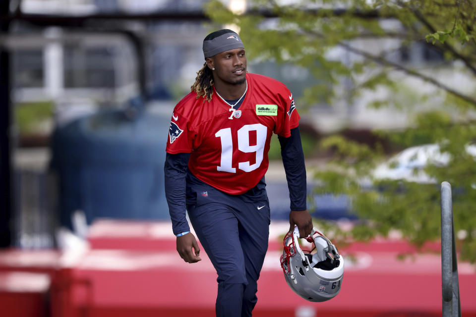 New England Patriots sixth round quarterback draft pick Joe Milton, III walks onto the field during the NFL football team's rookie minicamp Saturday, May 11, 2024, in Foxborough, Mass. (AP Photo/Mark Stockwell)