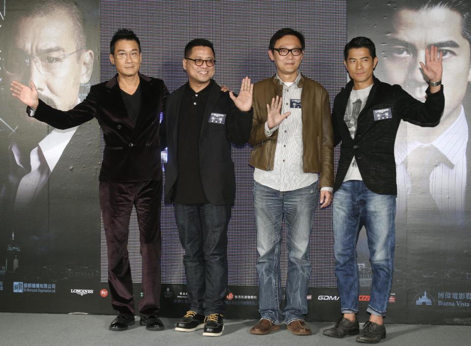 In this photo taken on Monday, Nov. 12, 2012, from left, Hong Kong actor Tony Leung Ka Fai, directors Lok Man Leung, Sunny Luk, and actor Aaron Kwok pose for the media during a promotional event for their new film "Cold War" in Taipei, Taiwan. (AP Photo/Chiang Ying-ying)