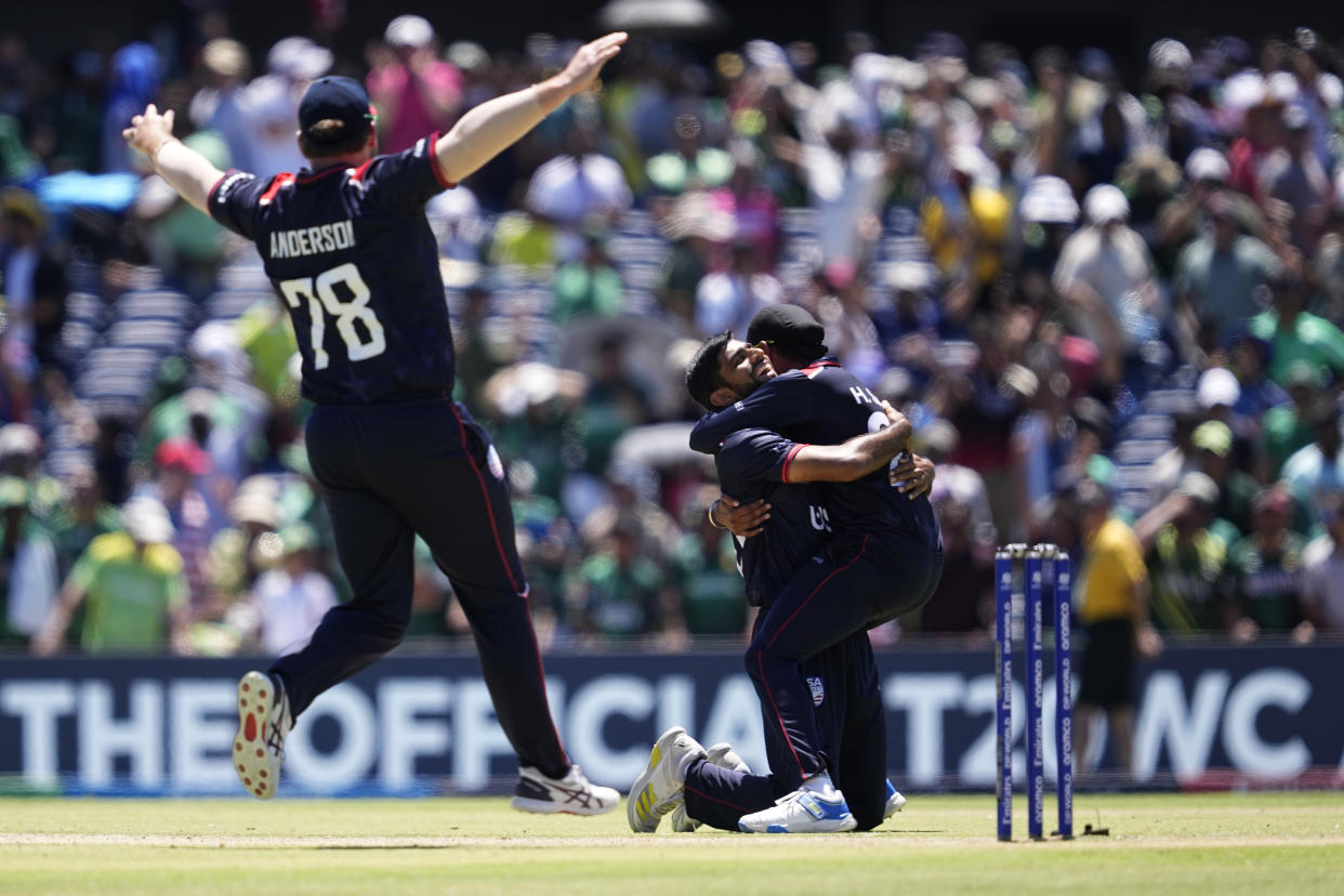 United States' Saurabh Nethralvakar, center, celebrates with teammates after their win in the ICC Men's T20 World Cup cricket match against Pakistan at the Grand Prairie Stadium in Grand Prairie, Texas, Thursday, June 6, 2024. (AP Photo/Tony Gutierrez)