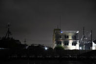 This Friday, July 19, 2019 photo shows the Kyoto Animation building that was destroyed in an arson attack in Kyoto, Japan. A man screaming "You die!" burst into an animation studio in Kyoto, doused it with a flammable liquid and set it on fire Thursday, killing several people in an attack that shocked the country and brought an outpouring of grief from anime fans. (AP Photo/Jae C. Hong)