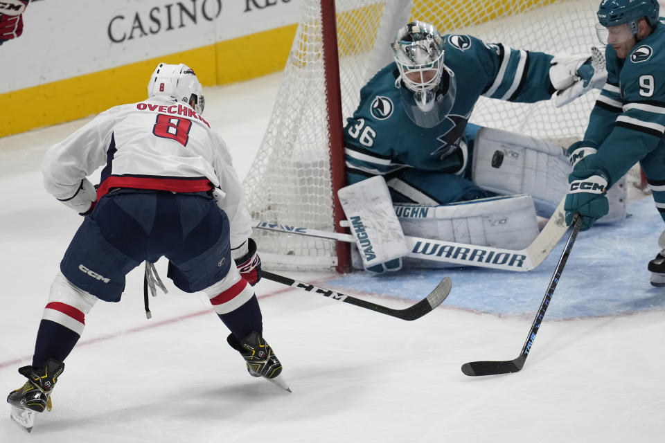 Washington Capitals left wing Alex Ovechkin (8) scores a goal against San Jose Sharks goaltender Kaapo Kahkonen (36) during the third period of an NHL hockey game in San Jose, Calif., Saturday, March 4, 2023. (AP Photo/Jeff Chiu)