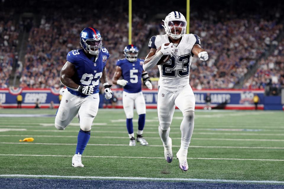 EAST RUTHERFORD, NEW JERSEY - SEPTEMBER 26: Rico Dowdle #23 of the Dallas Cowboys scores a 15 yard touchdown 
 during the first quarter against the New York Giants at MetLife Stadium on September 26, 2024 in East Rutherford, New Jersey. (Photo by Luke Hales/Getty Images)