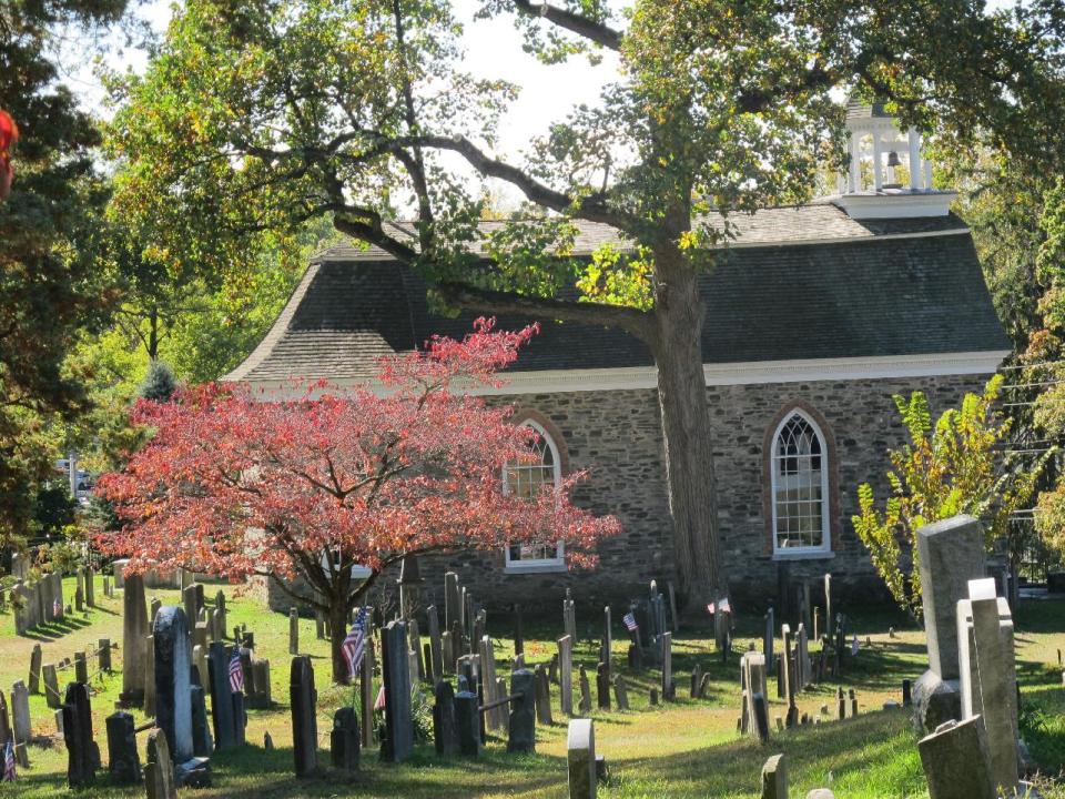 This photo of Oct. 18, 2013, shows the Old Dutch Church and Sleepy Hollow Cemetery in Sleepy Hollow, N.Y. The village of Sleepy Hollow is even busier than usual this Halloween, thanks to a new "Sleepy Hollow" TV series inspired by the tale of the Headless Horseman. (AP Photo/Jim Fitzgerald)