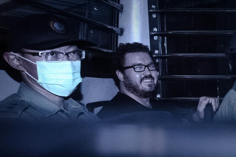 British banker Rurik Jutting (R) has pleaded guilty to manslaughter in the death of two Indonesian women who he recorded torturing and killing in his luxury flat in Hong Kong