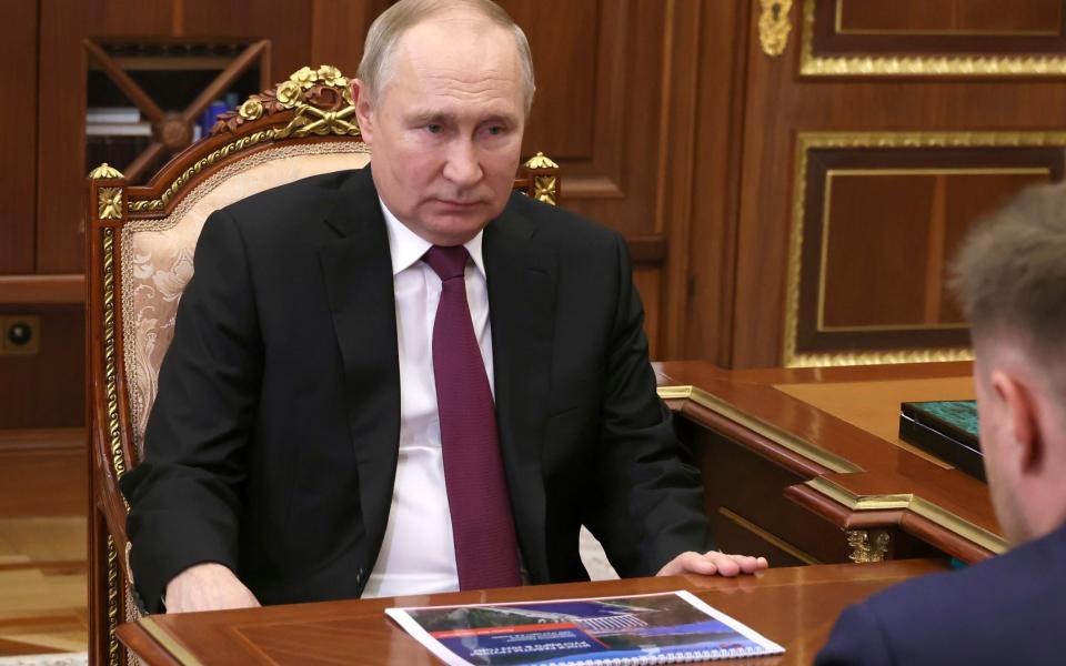 Vladimir Putin in the Kremlin today - Mikhail Klimentyev, Sputnik, Kremlin Pool Photo via AP