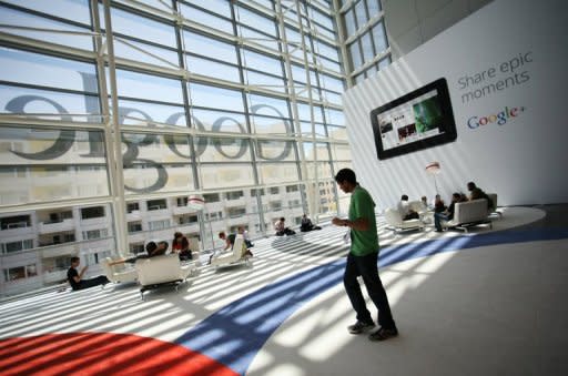 A Google logo is seen through windows of Moscone Center in San Francisco during Google's annual developer conference, in San Francisco on June 28