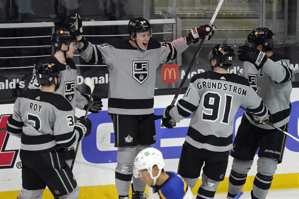 Los Angeles Kings right wing Matt Luff, center, celebrates his goal with teammates during the second period of an NHL hockey game against the St. Louis Blues, Saturday, March 6, 2021, in Los Angeles. (AP Photo/Marcio Jose Sanchez)