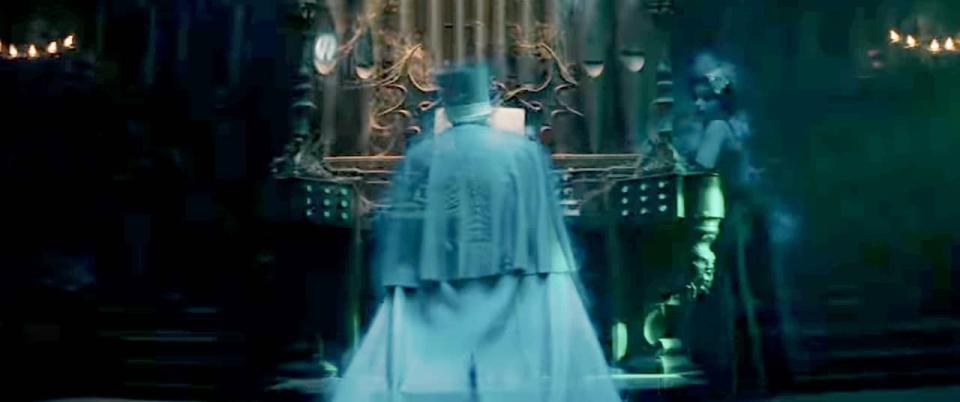 a ghost plays an organ in a scene from the haunted mansion, a good housekeeping pick for best kids' movie 2023