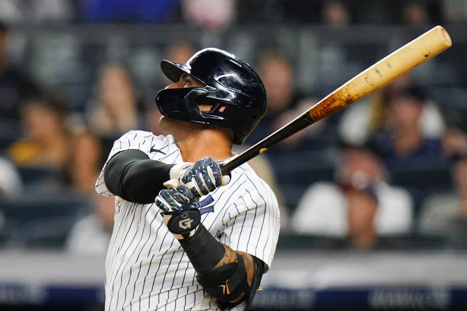 New York Yankees' Gleyber Torres watches his two-run home run during the eighth inning of the team's baseball game against the Cincinnati Reds on Thursday, July 14, 2022, in New York. (AP Photo/Frank Franklin II)