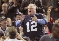 Toronto Mayor Rob Ford watches the CFL eastern final football game between the Toronto Argonauts and the Hamilton Tiger Cats in Toronto, November 17, 2013. REUTERS/Fred Thornhill (CANADA - Tags: SPORT FOOTBALL)