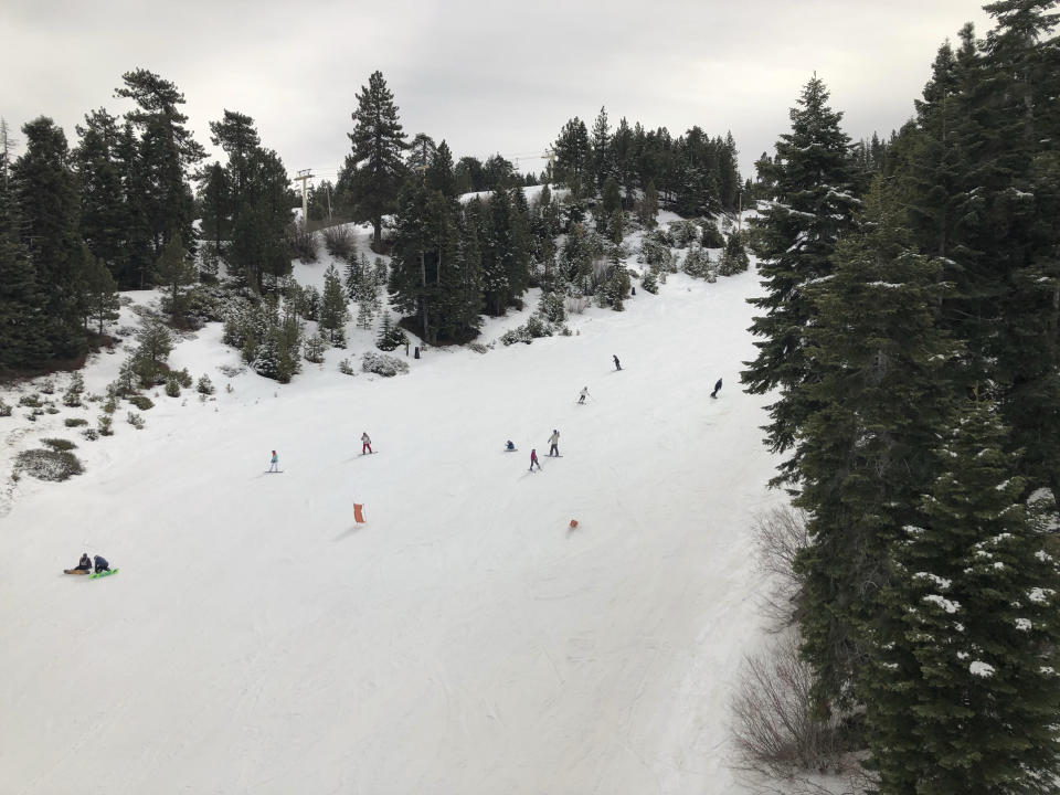 Skiers take to the slopes at Snow Summit ski resort in Big Bear Lake, Calif., on Friday, Feb. 1, 2019. A powerful storm heading toward California is expected to produce heavy rainfall, damaging winds, localized stream flooding and heavy snow in the Sierra Nevada. Forecasters say rain will arrive in the north late Friday afternoon and reach the south late in the night, and last through Saturday night. (AP Photo/Christopher Weber)