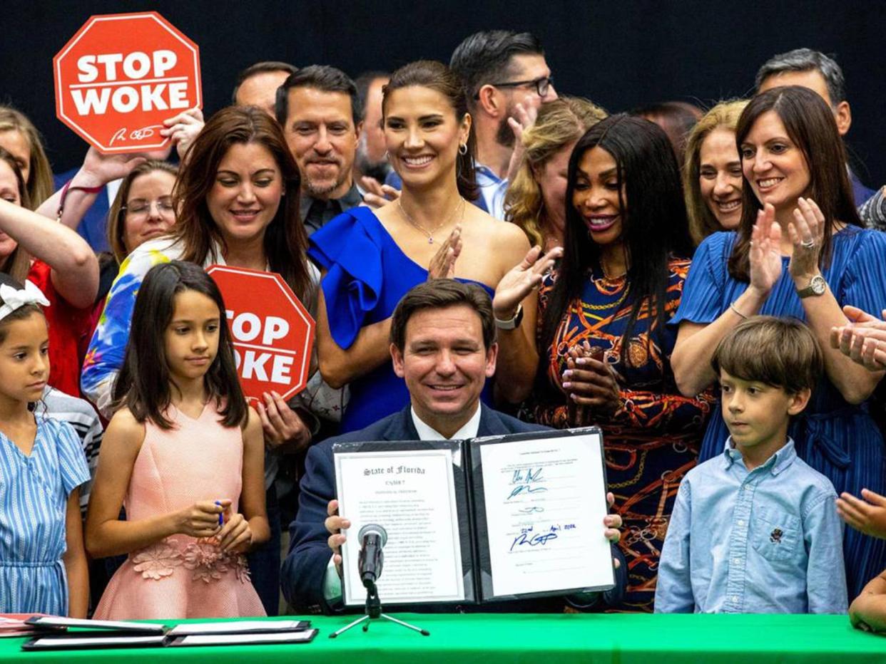 Florida Gov. Ron DeSantis reacts after signing HB 7, the "Stop WOKE" bill, at Mater Academy Charter Middle/High School in Hialeah Gardens, Florida, on Friday, April 22, 2022.