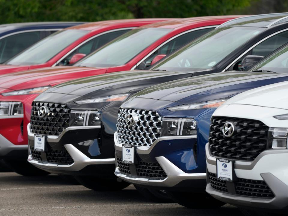 Hyundai SUVs at a car dealership.