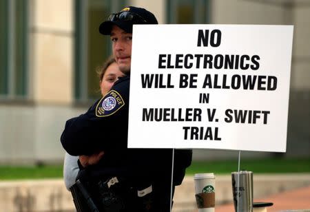 Security stands outside Denver Federal Court where the Taylor Swift groping trial jury selection is to resume in Denver, U.S., August 8, 2017. REUTERS/Rick Wilking