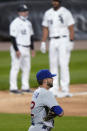 Chicago Cubs relief pitcher Ryan Tepera pauses after Chicago White Sox's Jose Abreu, right rear, hit a three-run double and advanced to third on an error during the fourth inning of a baseball game in Chicago, Saturday, Sept. 26, 2020. (AP Photo/Nam Y. Huh)