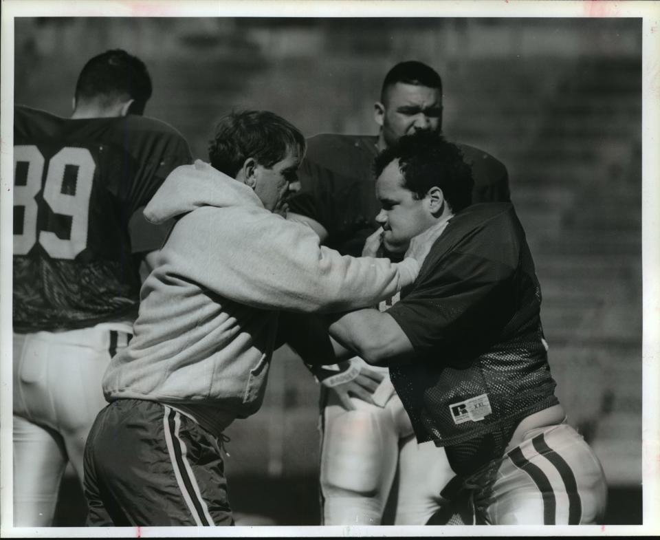 In this 1994 photo, Bernie Wyatt works on techniques with UW tight end Mike Roan.