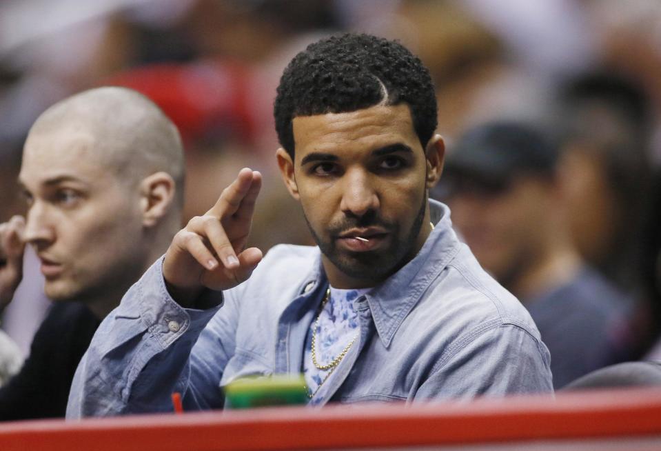 Rapper Drake attends the NBA basketball game between the Oklahoma City Thunder and the Los Angeles Clippers in Los Angeles, Wednesday, April 9, 2014. (AP Photo/Danny Moloshok)