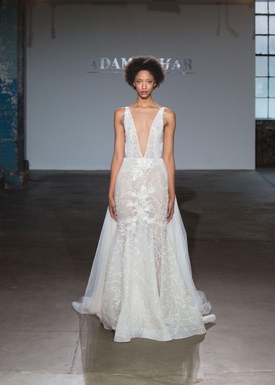 <p>Deep V-cut, semi-sheer wedding dress. (Photo: Hatnim Lee) </p>