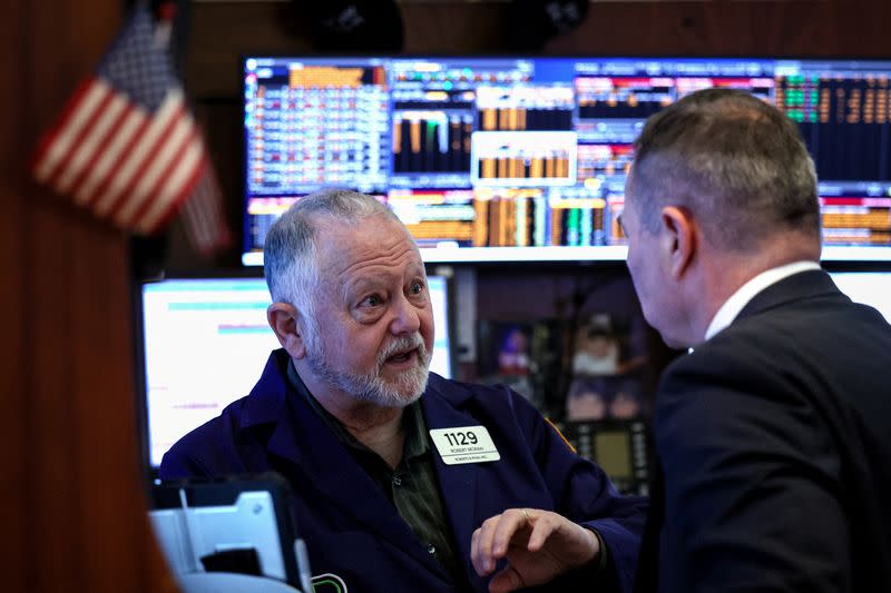 Traders work on the floor of the NYSE in New York